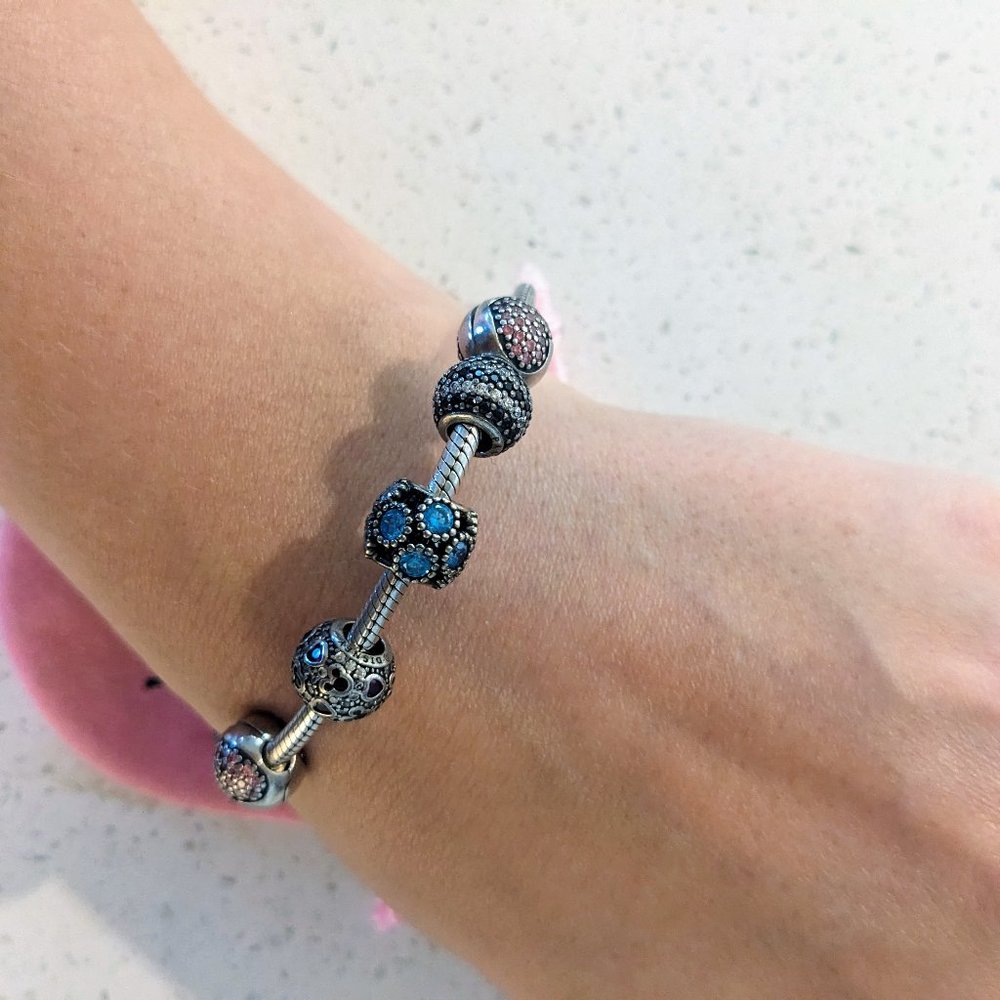 Pandora bracelet with heart, mickey charms, blue stones, bag and box